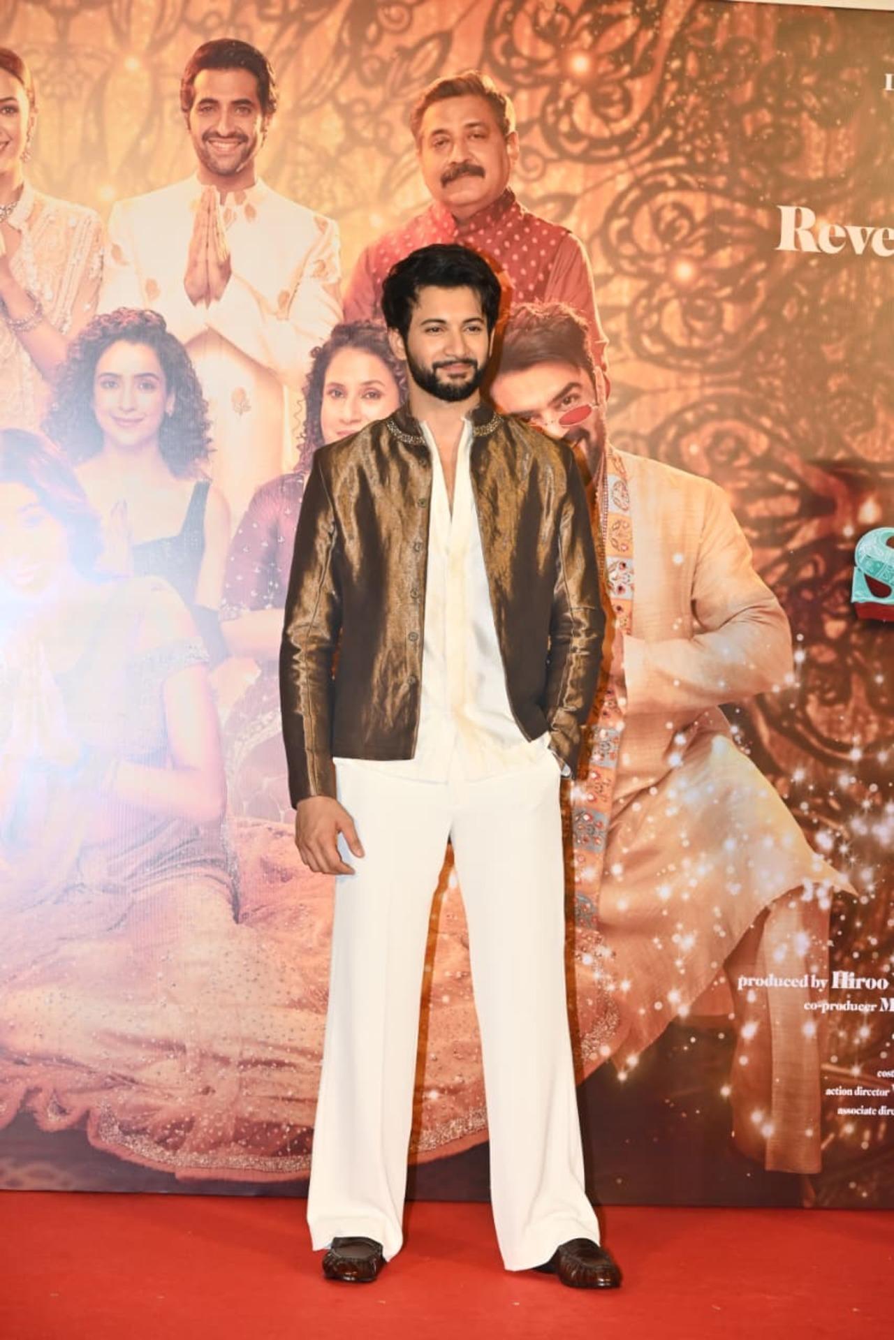 While Rohit Saraf looks effortlessly charming in a white trouser and shirt which he paired with stylish metallic bronze jacket. 